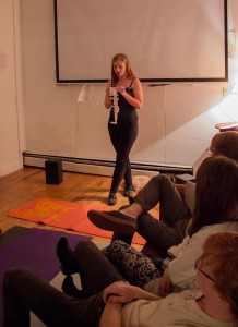 Junior interdisciplinary studies major Colleen Choate reading poetry at 3rd Place on Sunday night. Photo by Dallas Linger  |  The Appalachian