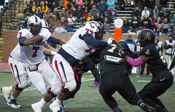 Senior quarterback Brandon Bridge looks for room to scramble out of the pocket in Saturdays game against App State. The Mountaineers lost 47-21 in its conference home opener.
Malik Rahili  |  The Appalachian