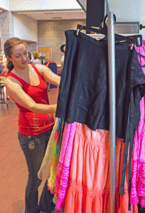 Senior theatre arts major Carmen Lawrence looking through costumes during the Tech Theatre Club’s annual costume sale in the Valborg Theatre on Friday afternoon in Valborg Theatre. Photo by Dallas Linger  |  The Appalachian