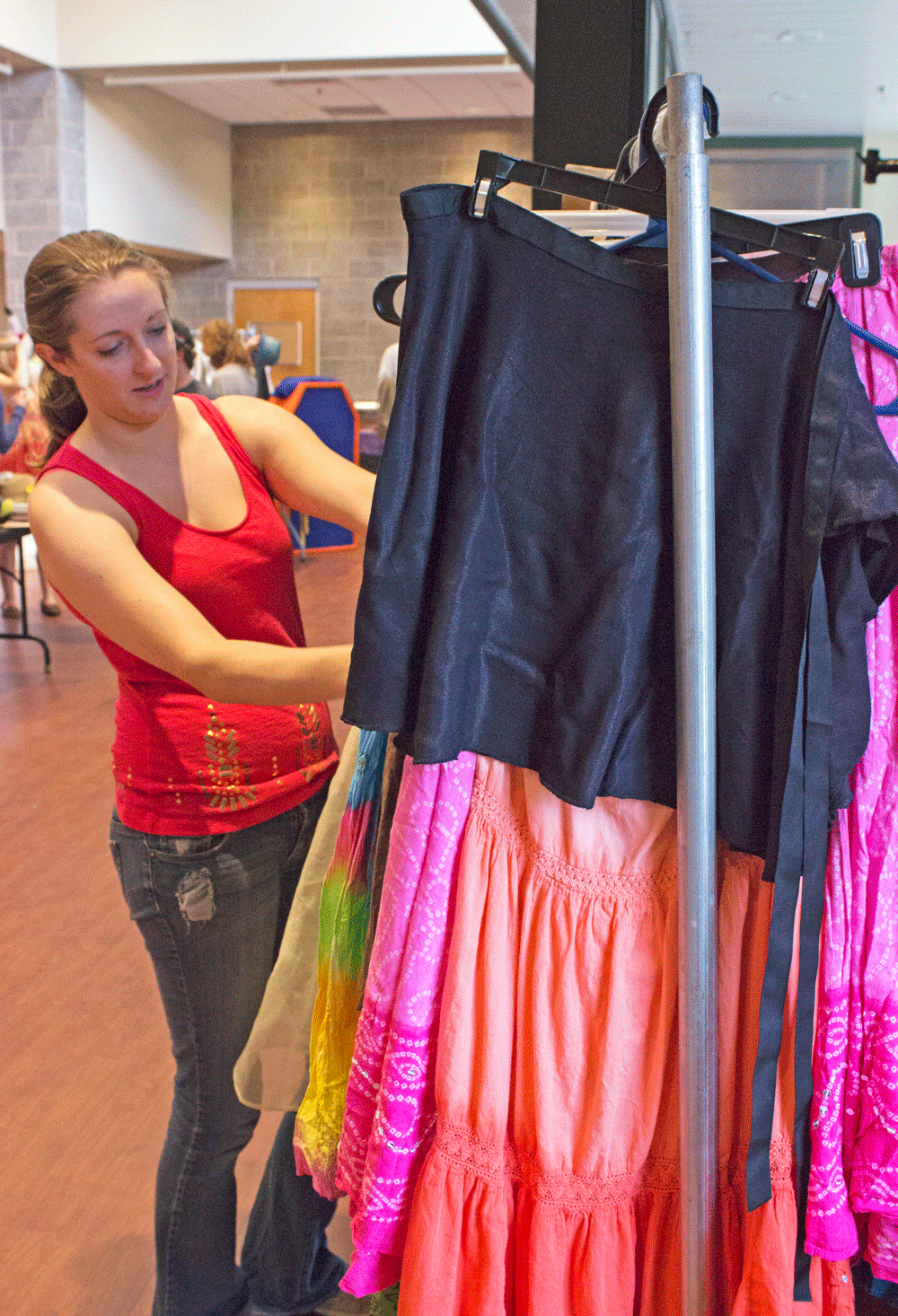 Senior theatre arts major Carmen Lawrence looking through costumes during the Tech Theatre Club’s annual costume sale in the Valborg Theatre on Friday afternoon in Valborg Theatre. Photo by Dallas Linger  |  The Appalachian