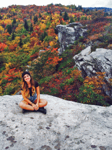 Sophomore biology major Adrianna Castro sits on a cliff at the top of Rough Ridge. The hike at Rough Ridge is a favorite among several Appalachian State University students. Photo courtesy of Nicholas Lisle