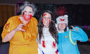 Freshman biology major Amanda Wilkinson (left), sophomore special education major Taylor Mundy (center) and sophomore computer science major Chris Roth (right) in their costumes Friday night in the Grandfather Mountain Ballroom. Photo by James Johnston  |  The Appalachian