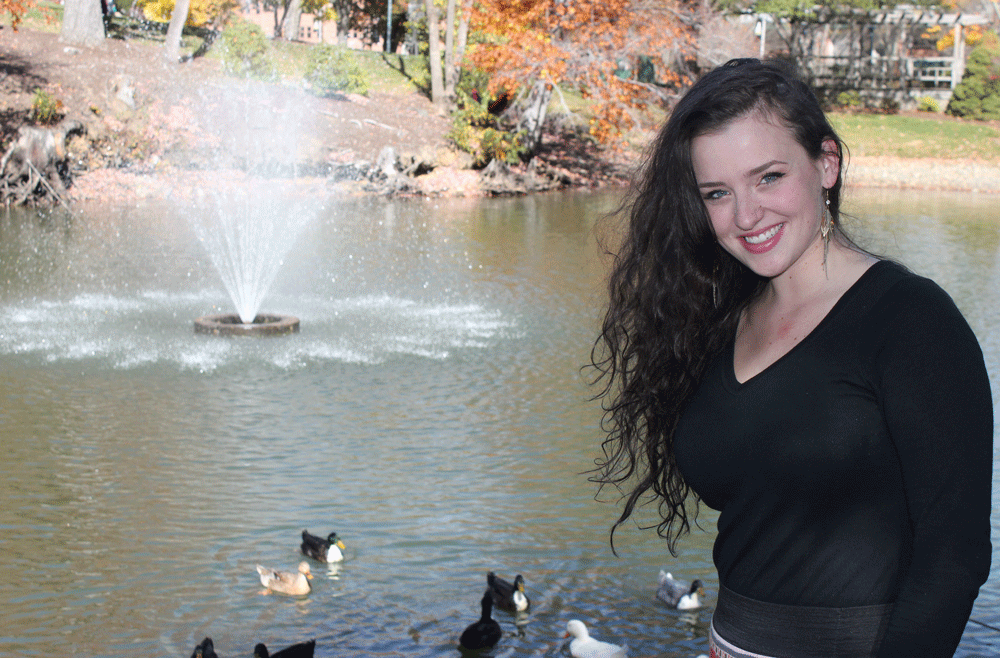 Senior graphic design major Glory Silwedel on Oct. 24 at Duck Pond. Silwedel is planning to build a home for the ducks living at Duck Pond to protect them from Boone’s harsh winters. Photo by Maggie Davis  |  The Appalachian