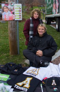 Assistant men’s track coach David Ward and his wife Dawn Ward volunteer for Samaritan's Purse's Operation Christmas Child on Saturday afternoon. They held a free raffle of Appalachian gear to promote the cause. Photo by Dallas Linger  |  The Appalachian