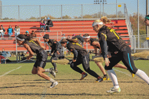 Members of Appalachian State's Quidditch team running the field last weekend at the Mid-Atlantic Regional Championship. Courtesy of Alexandria Gates