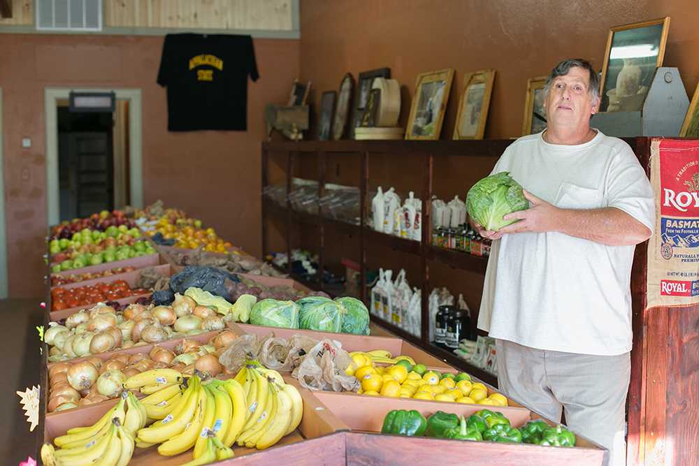 Veggies, Fruits, and More owner Allen Curtis at his new location on King Street, a transition from his location on extension 105. Photo by Sarah Weiffenbach  |  The Appalachian