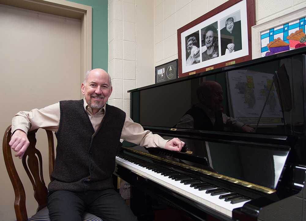 William Pelto, dean of the Hayes School of Music, poses beside a piano. The department received a renewal of its accreditation from the National Association of Schools of Music. Photo by Sarah Weiffenbach  |  The Appalachian