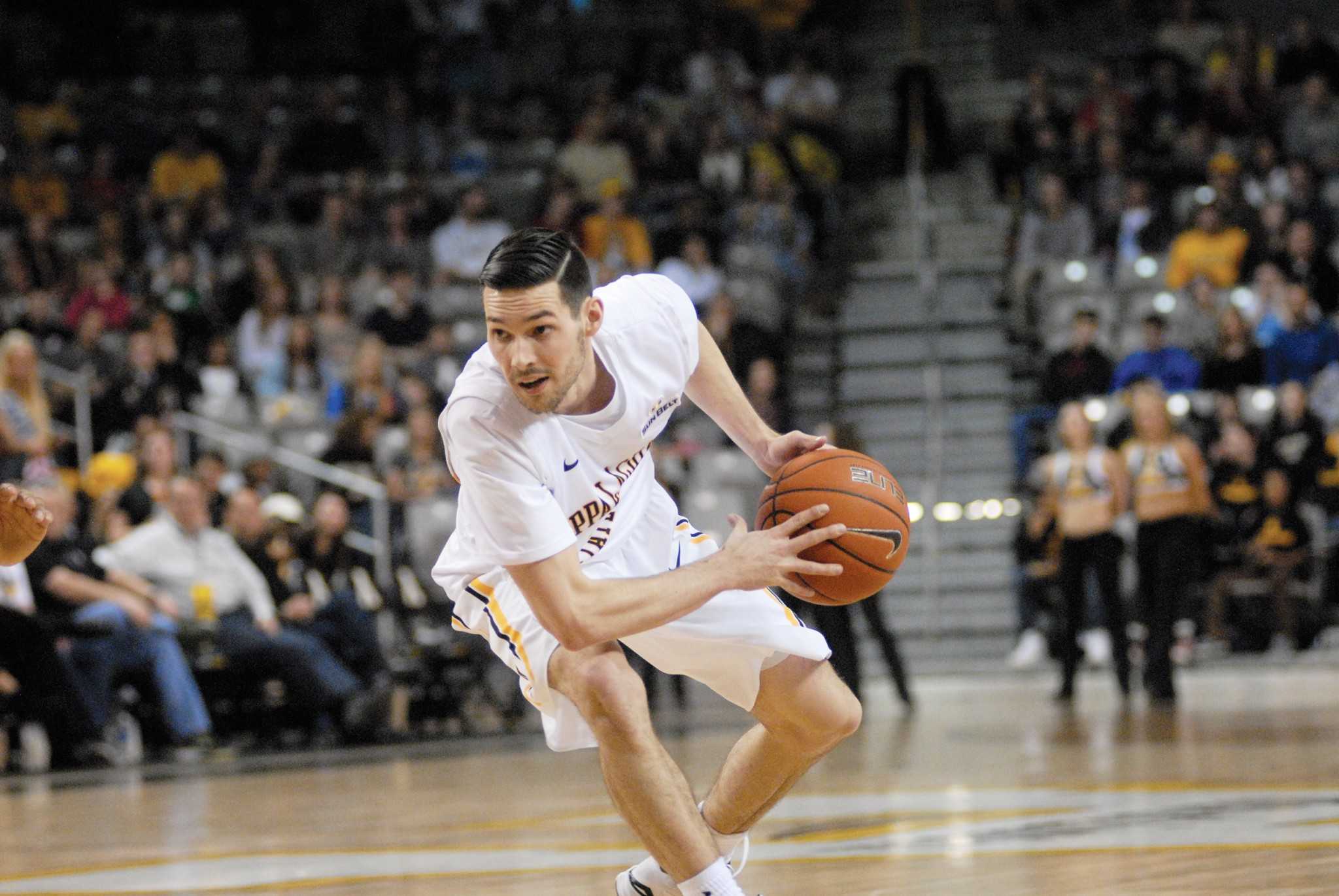 Junior guard Dustin Clarke handles the ball and prepares to make a pass against Troy this season. Clarke is averaging more than 20 minutes per game for the Mountaineers. Photo by Corey Spiers |  The Appalachian