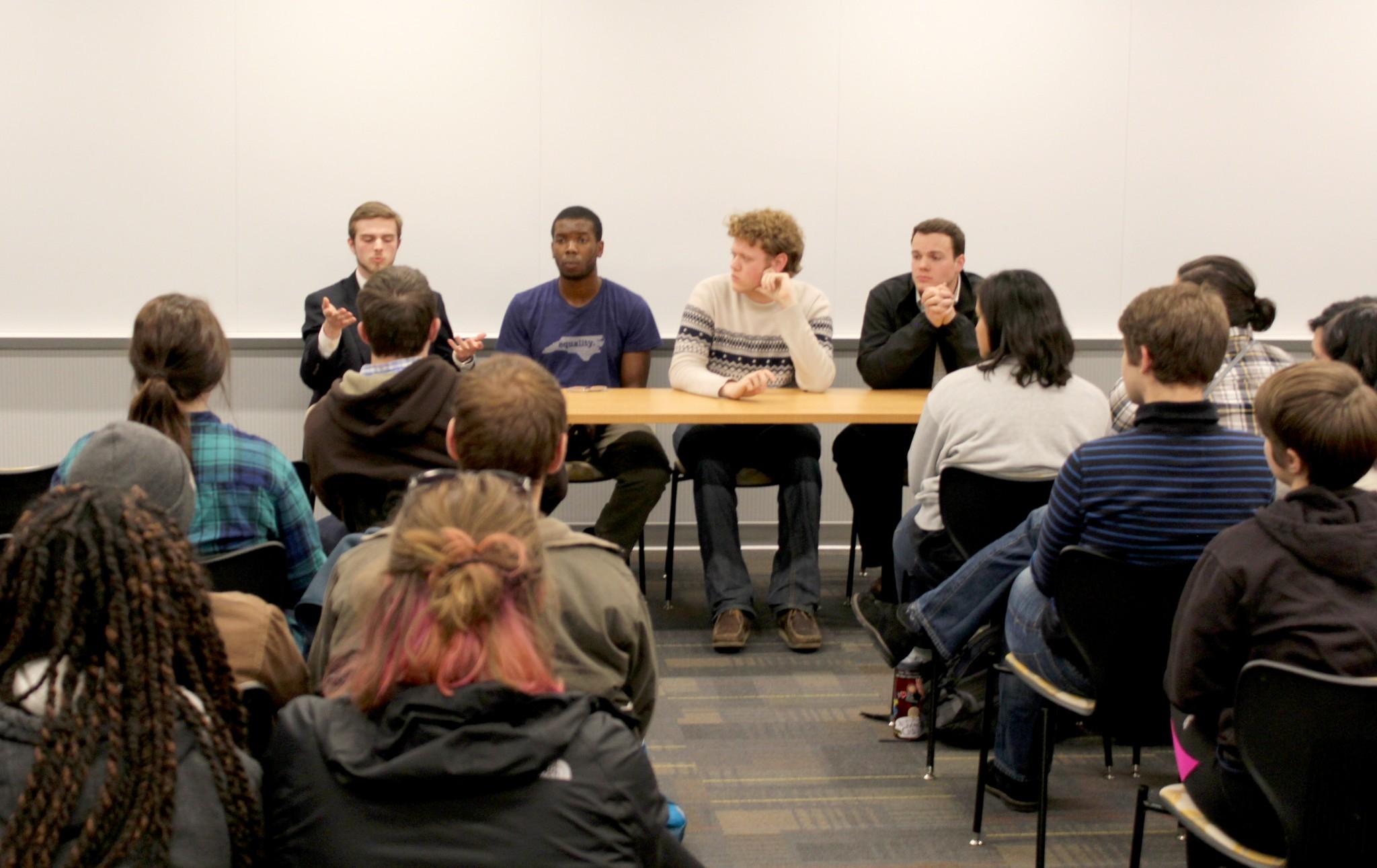 Sam Murray, Chukwuebuka Ibeziako, Patrick Long, and Carson Rich answer questions posed by the Women's Center and audience members regarding sexual assault.
