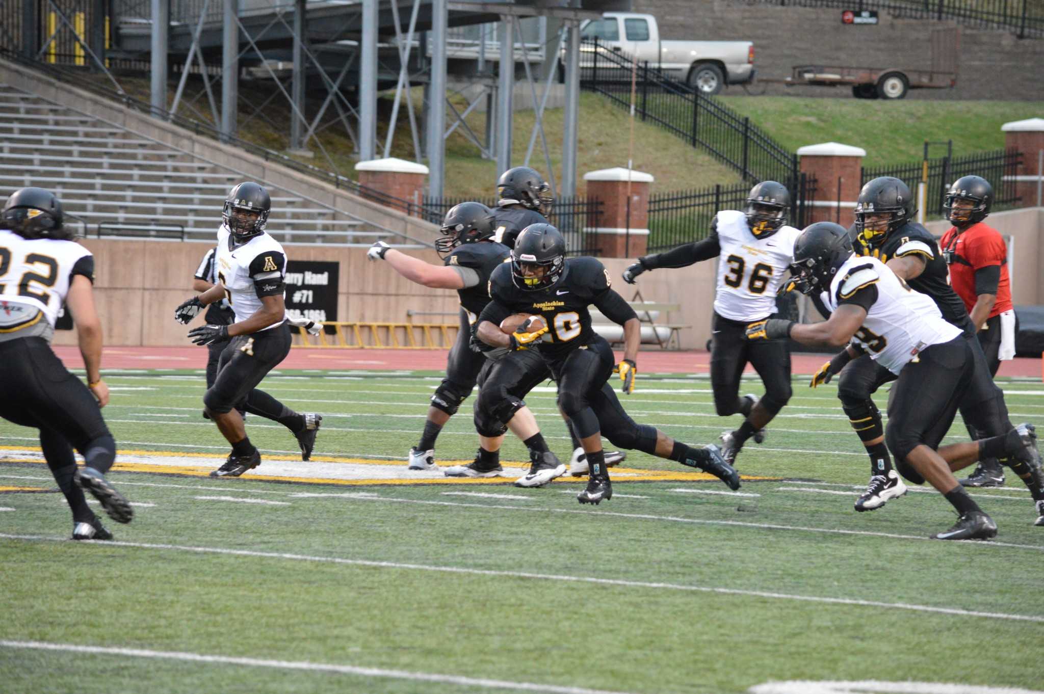 Sophomore running back Terrence Upshaw carries the ball in last years spring game. There will not be a spring game this season due to the unpredictable nature of high country weather, the program announced.