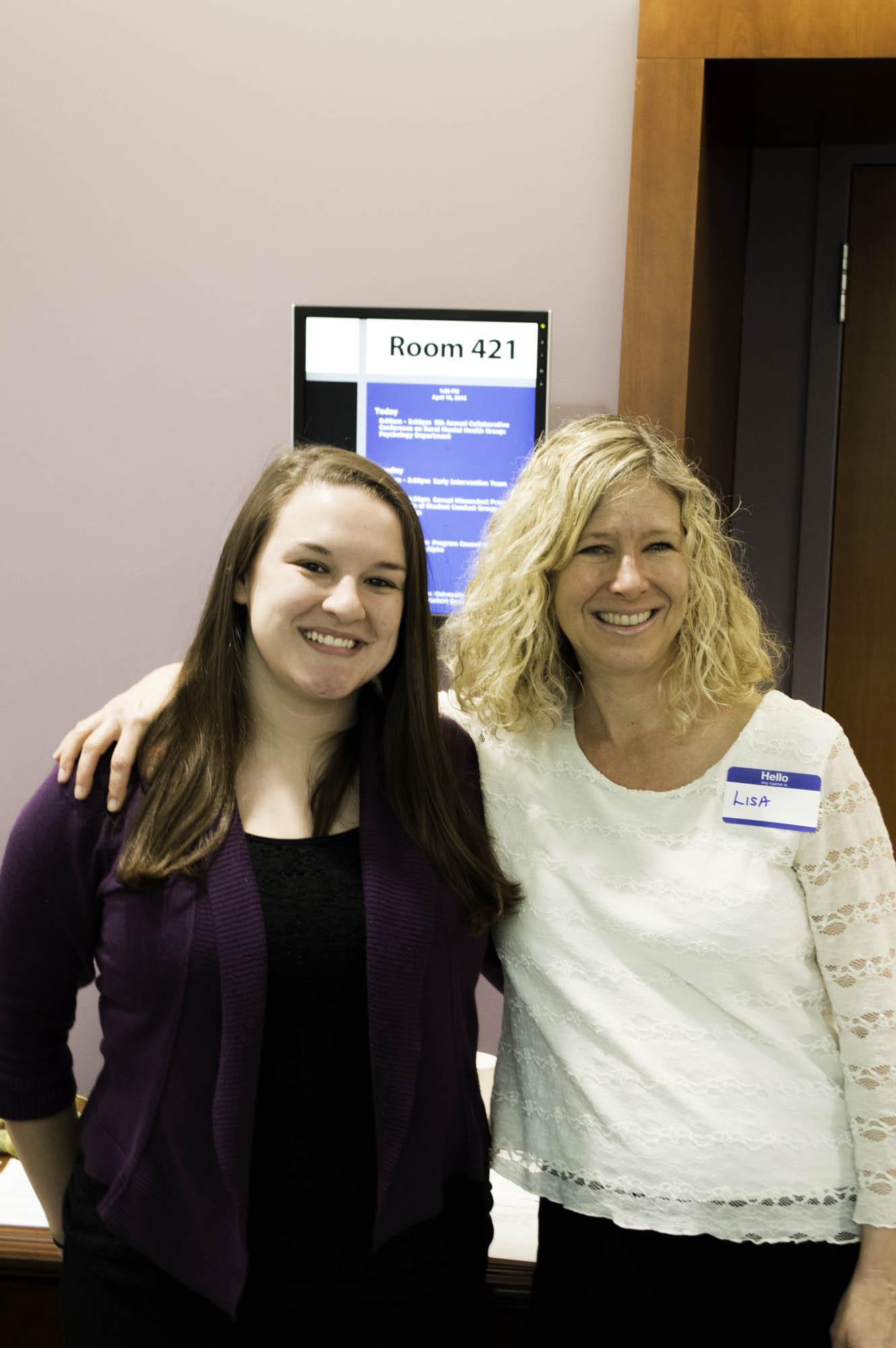 Appalachian pyschology professor Lisa Curtin (right) poses with a student at a conference. Photo: Jordan Kimbrell