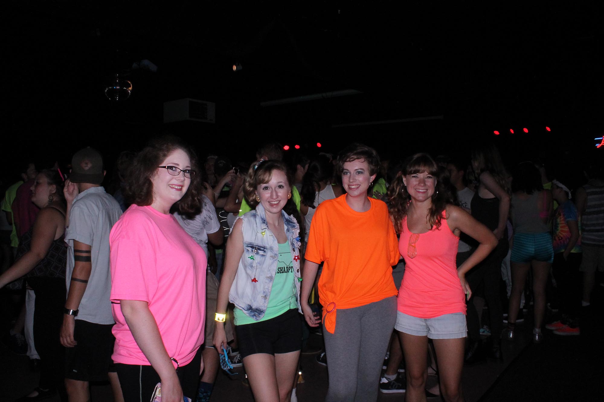 Students Cheyenne Grubbs, Ashlynn Whitesell, Rebecca Summey, and Adrienne Fouts pose for a picture a the Glow Party on Saturday night, August 22nd. The party was held at Legends and it was in honor of the new semester starting.