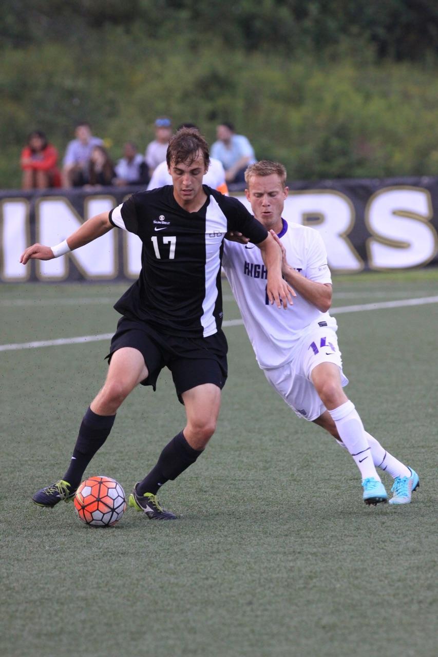 Senior forward Stephen Chapman dribbles a ball past the defense during Saturdays game against High Point. The Mountaineers defeated the Panther 5-1. Photo courtesy of Bill McCarter. 