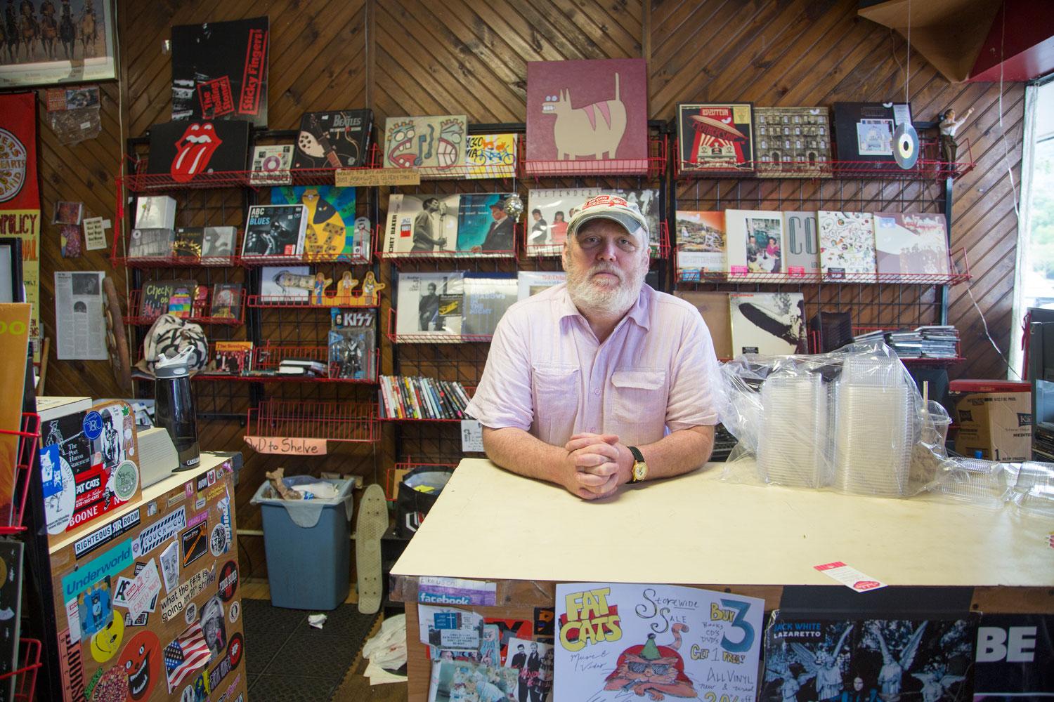  Store owner Kevin Fritch poses for a photo inside of Fat Cats record store on King Street. 