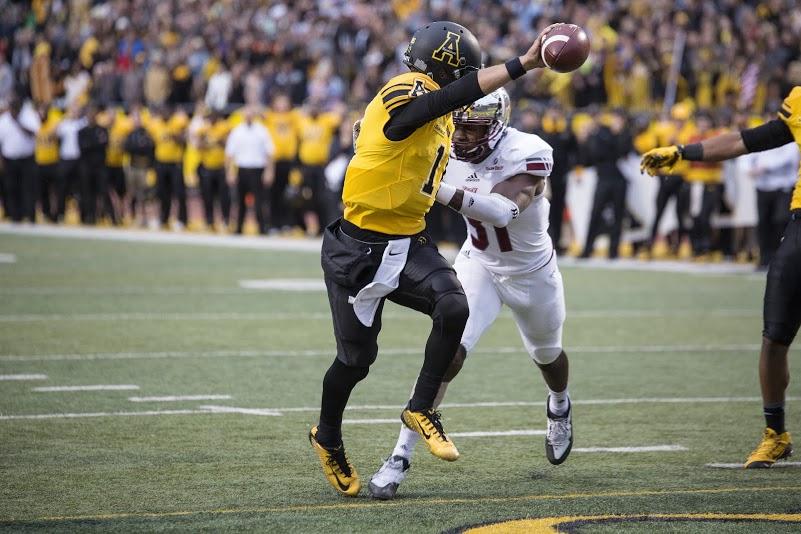 Quarterback Taylor Lamb stretches the ball across the goal line to score his first of two rushing touchdowns against Troy. App State defeated the Trojans 44-41 in triple overtime.  Chris Deverell | The Appalachian 