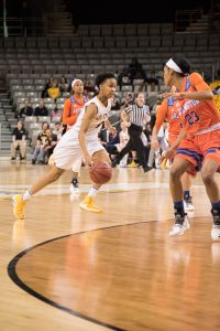 Sophomore guard Q. Murray, dribbles the ball down the court during the game against UT Artlington. The Mountaineers lost against the Mavericks with the final score being 62-73
