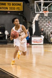 Sophomore guard Q. Murray, dribbles the ball down the court during the game against UT Arlington. The Mountaineers lost the the Mavericks with the final score being 62-73.