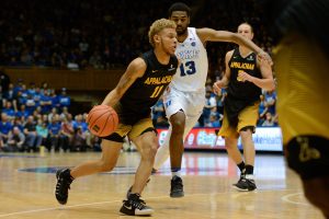 Sophomore Emarius Logan drives past Duke's Matt Jones 