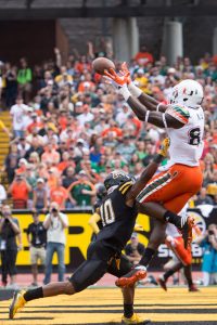 Defensive back A.J. Howard attempts to intercept the pass that becomes the Hurricane's second touchdown in the first quarter. 