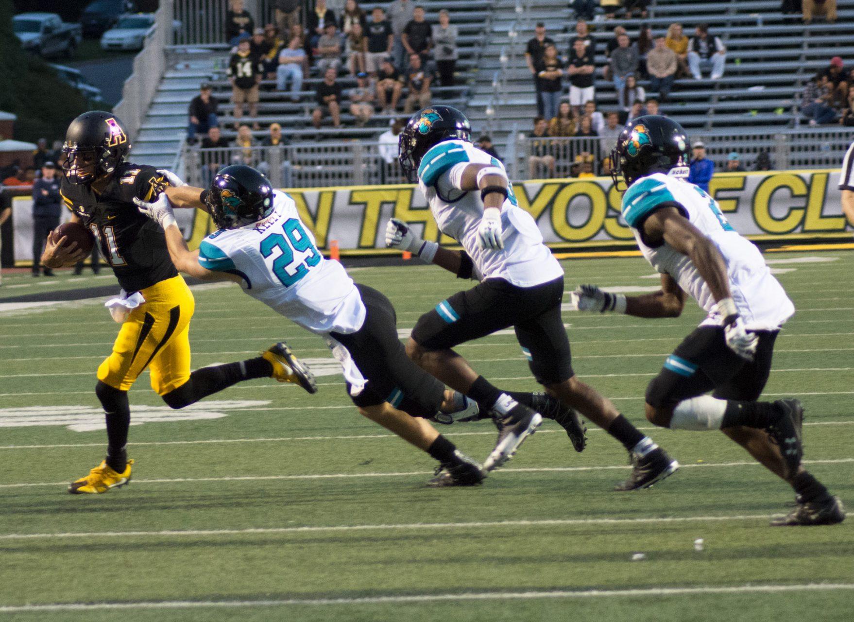 Taylor Lamb running for a first down against Coastal Carolina at Kidd Brewer Stadium.  Lamb set the all-time App State record for career passing touchdowns in today's win.