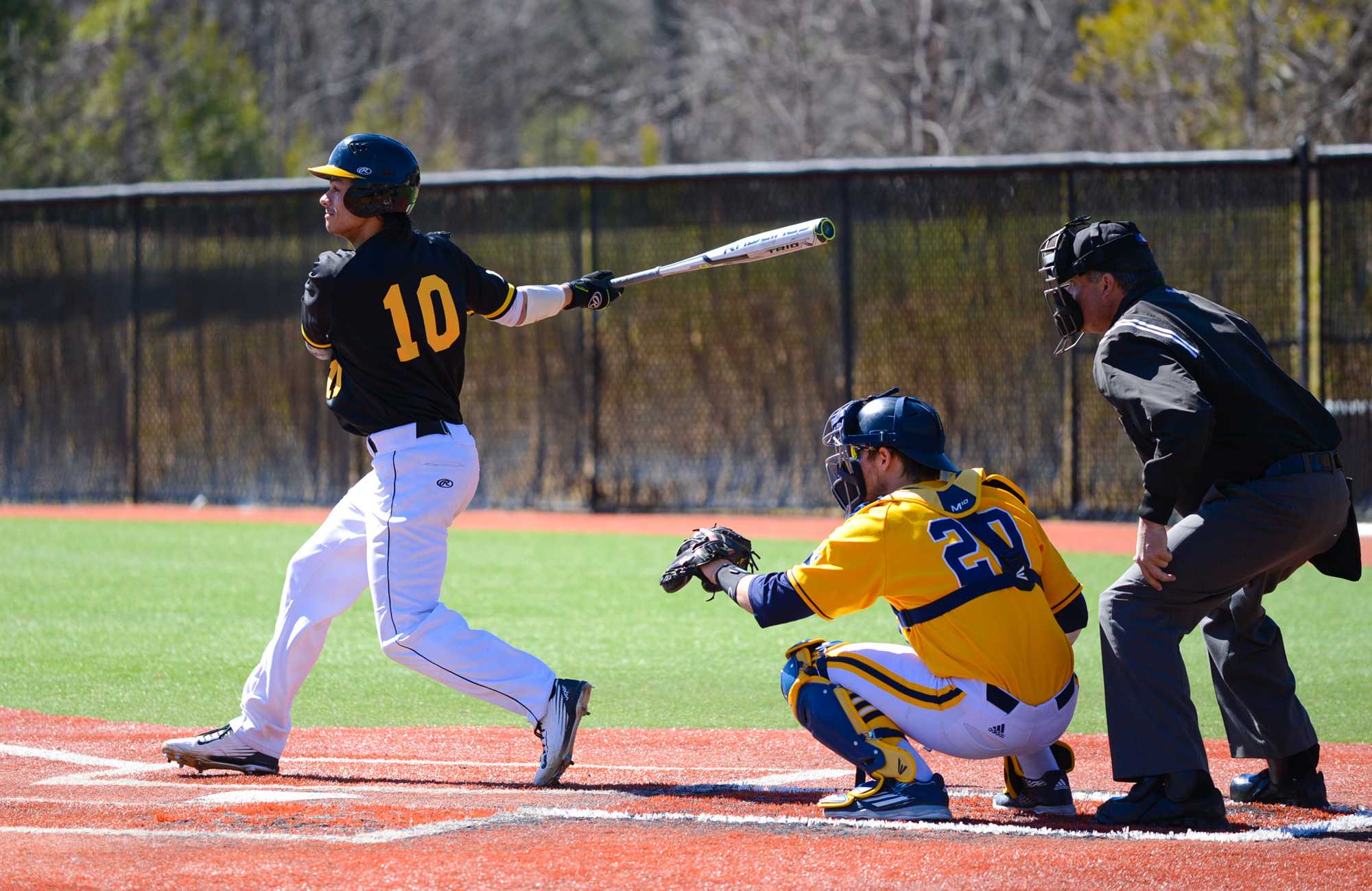 Freshman+outfielder+Tanner+Mann-Fix+completes+his+swing+followed+by+a+slide+to+third+base+on+February+28+against+Quinnipiac.+Photo+by+Dallas+Linger.