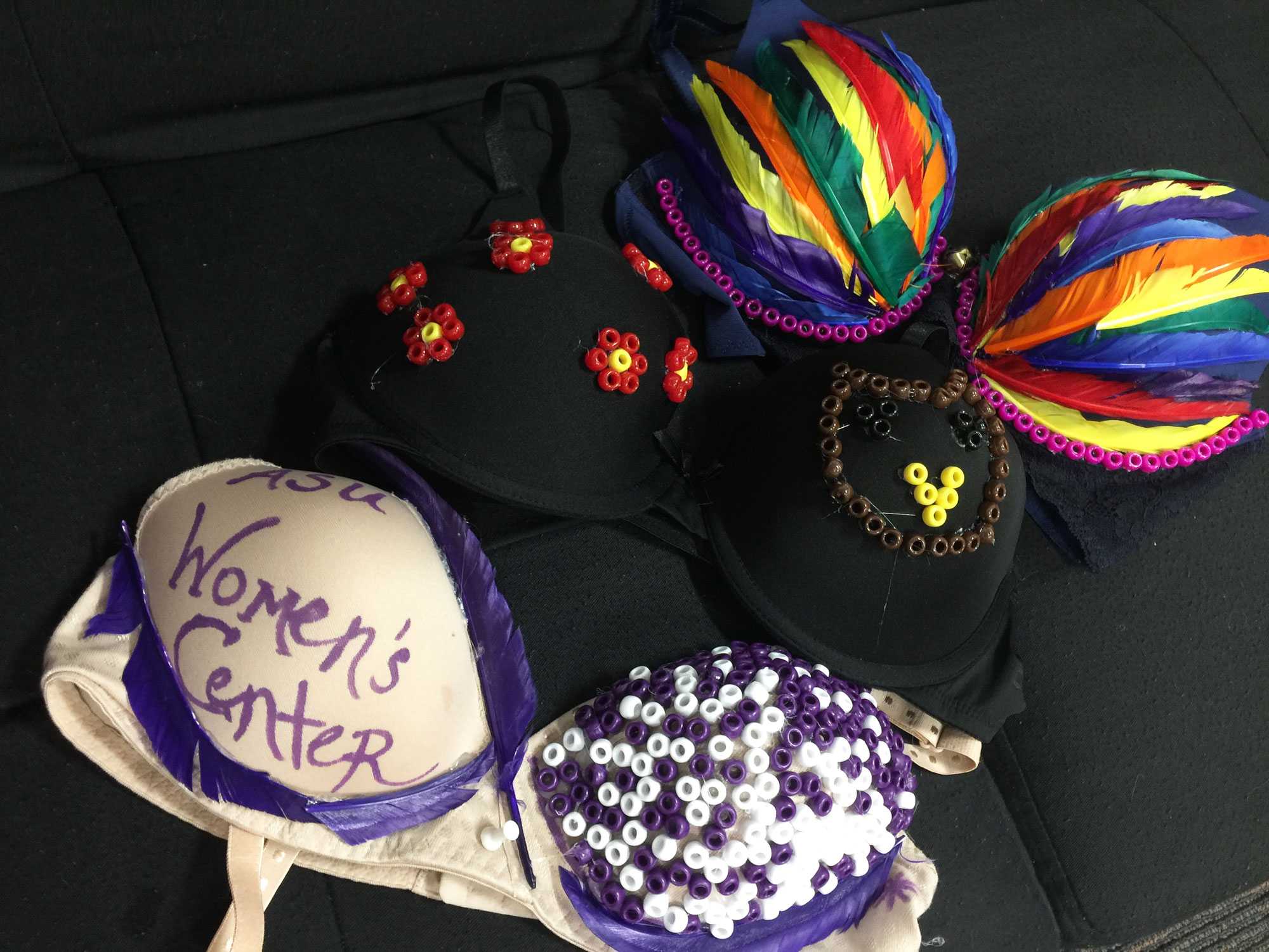 A couple of the bras that were decorated during the BraVa event. The bras will be on display at Luna Fest which is on April 6th and 7th. The event is a fundraising film festival to promote awareness about womens issues and appreciating women filmmakers. 