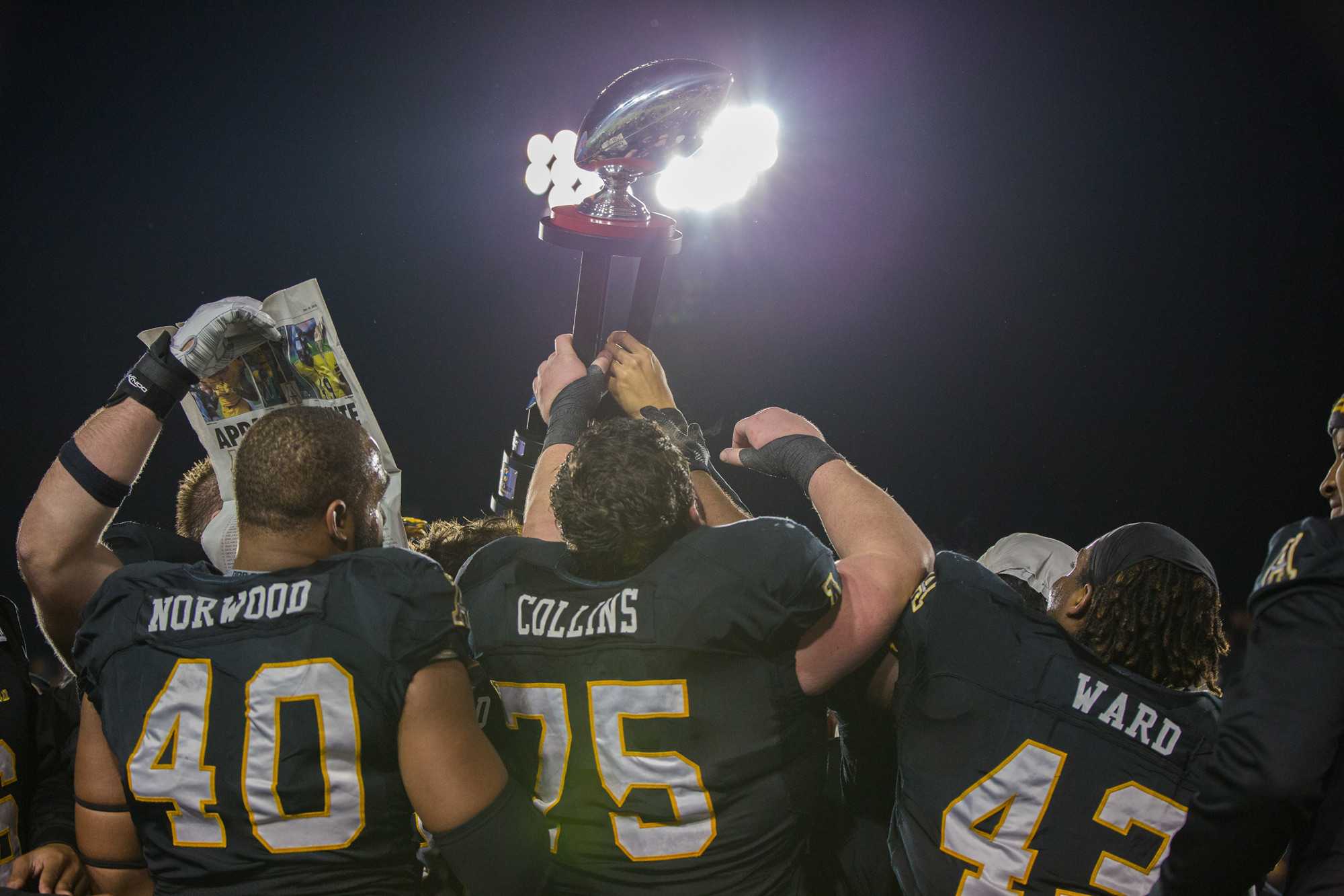 The Mountaineers celebrate after winning the Raycom Media Camellia Bowl. They defeated Ohio 31-29. 