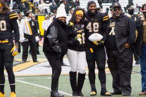 Dezmin Reed  being honored with his family for senior night before the game against UL Monore. 