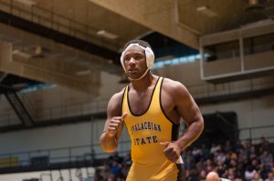 Denzel Dejournette wins by forfeit against Belmont Abbey.