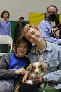 Owner Christiana Phlox and friend Owen with her dog Yuba, the mini australian shepherd who competed and won Best Wiggly Butt