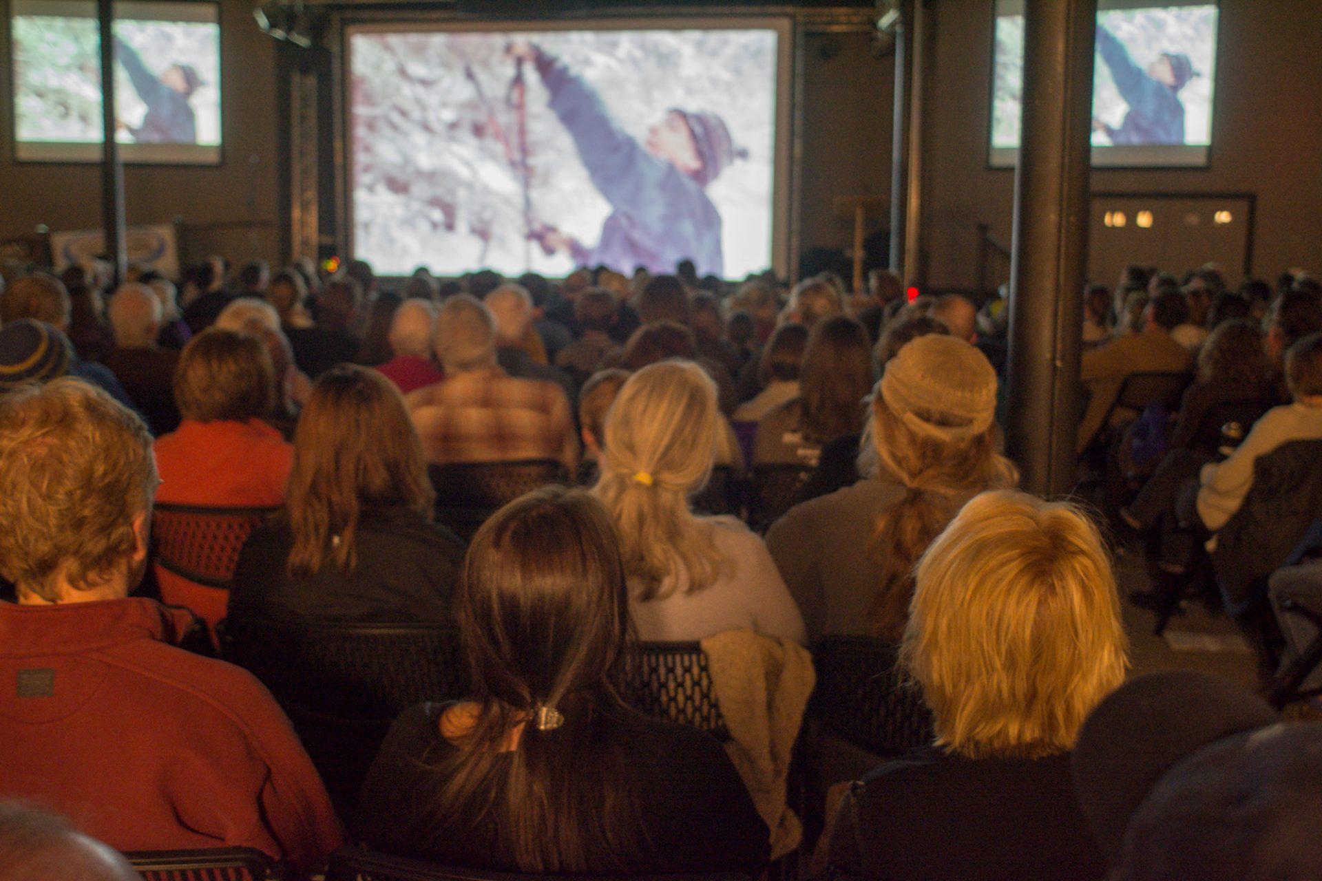 The+audience+watches+film+entries+during+the+2016+festival.