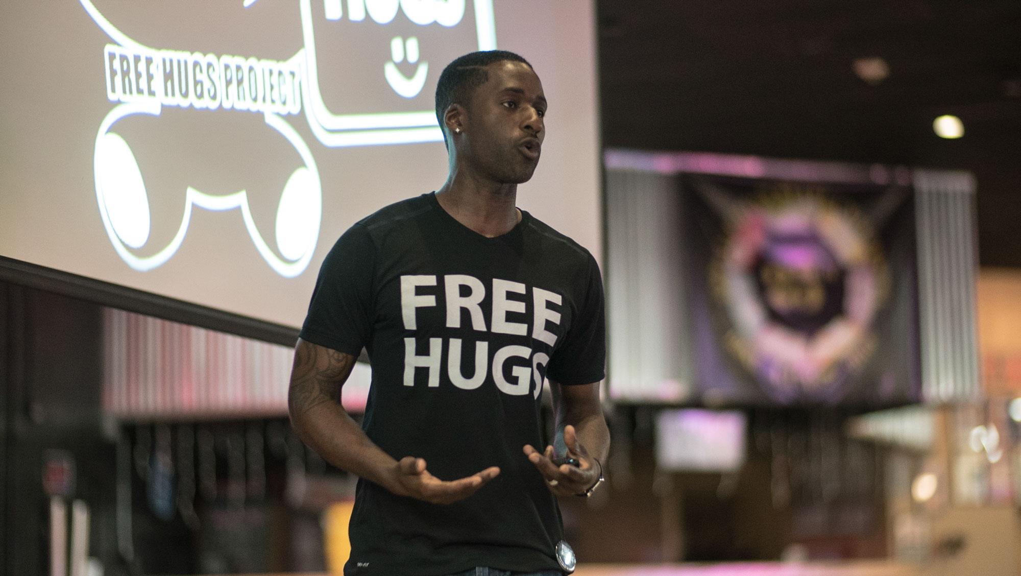 Ken Nwadike speaking at Legends for the Free Hugs Project. His video giving free hugs to the runners at the Boston Marathon went viral.