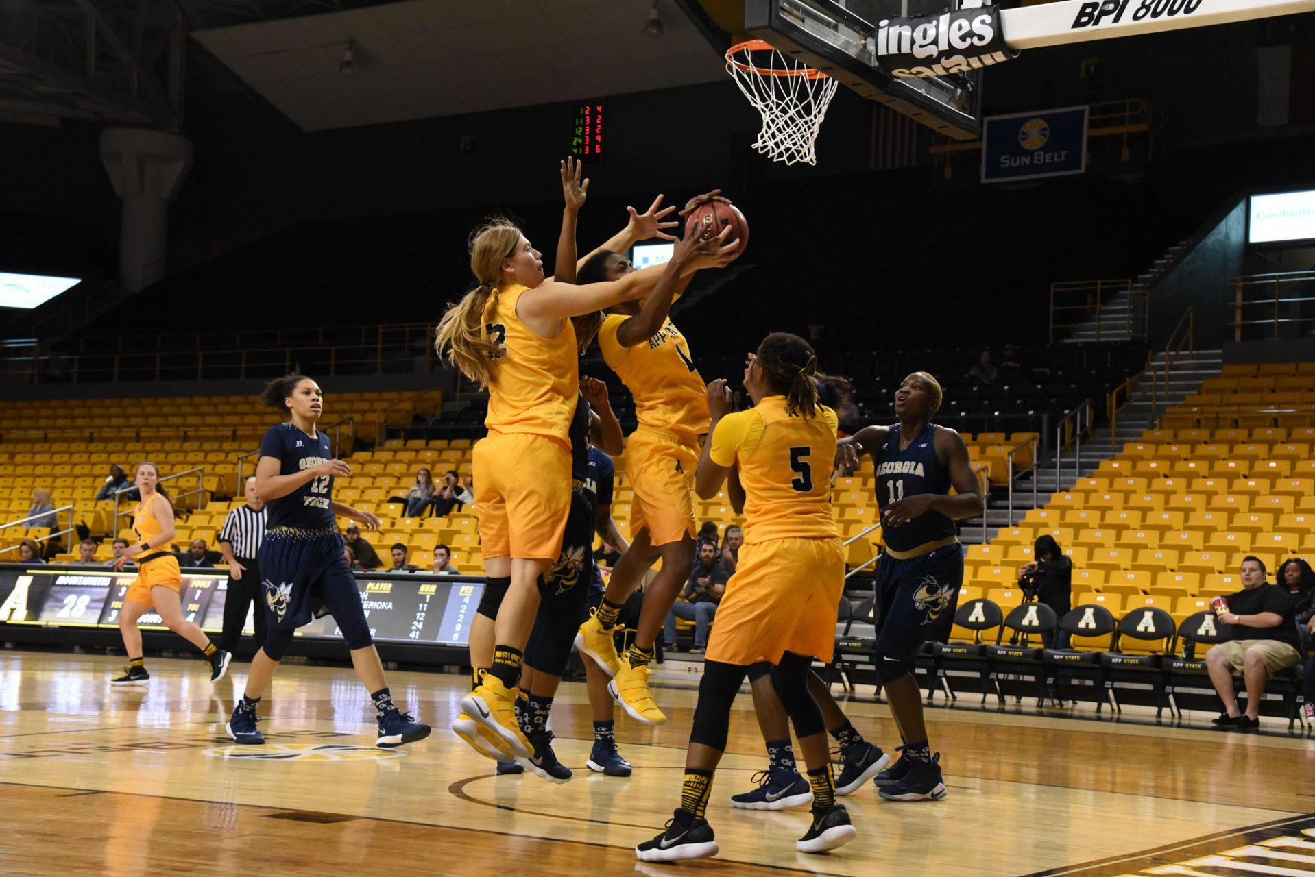 Sophomore center  Bayley Plummer and freshman Maya Calder both jump up to score during the game against Georgia Tech.  