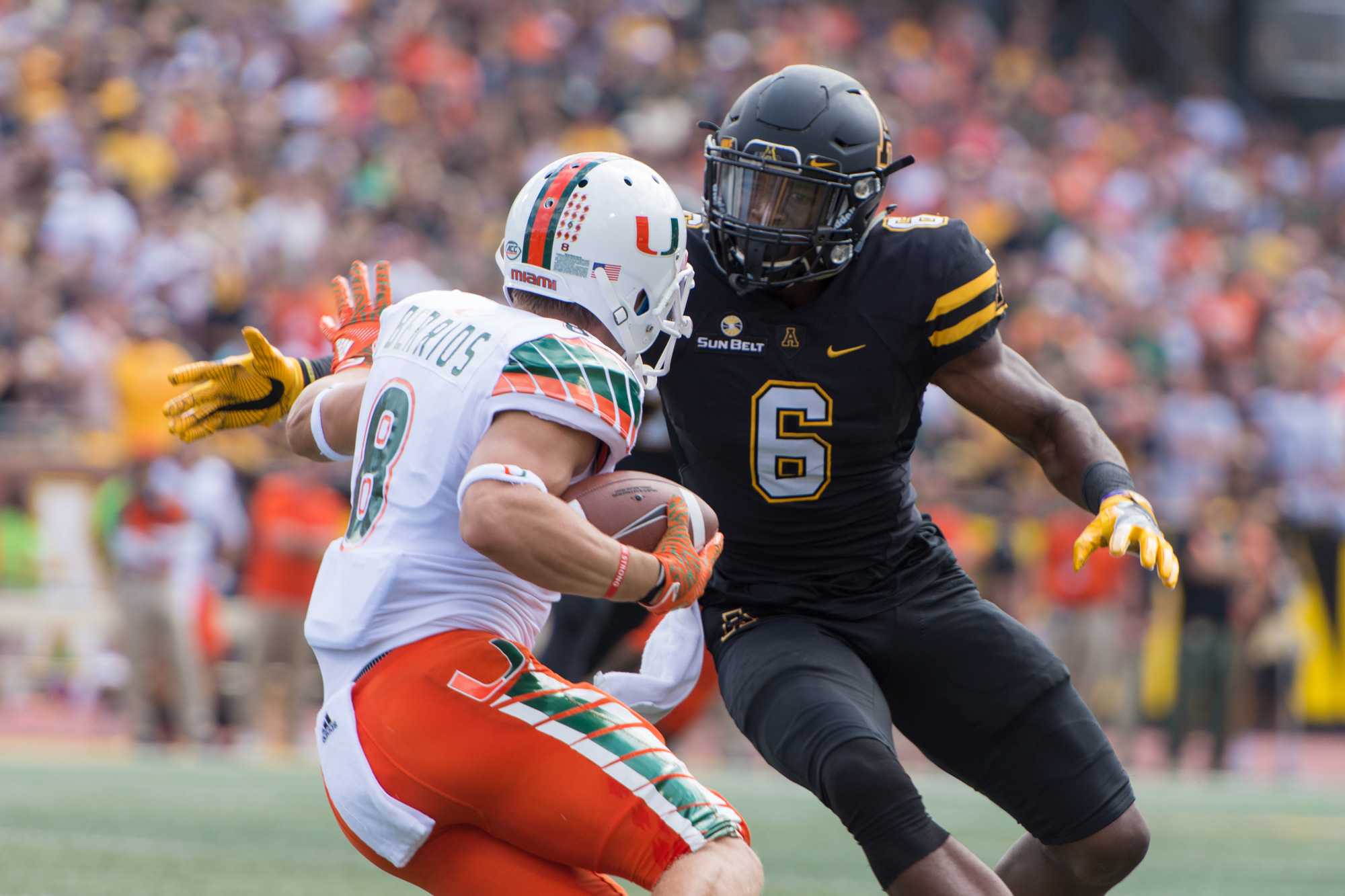 Outside linebacker Kennan Gilchrist attempts to stop Miami wide receiver Braxton Berrios from running the ball. Photo by Dallas Linger, Photo Editor