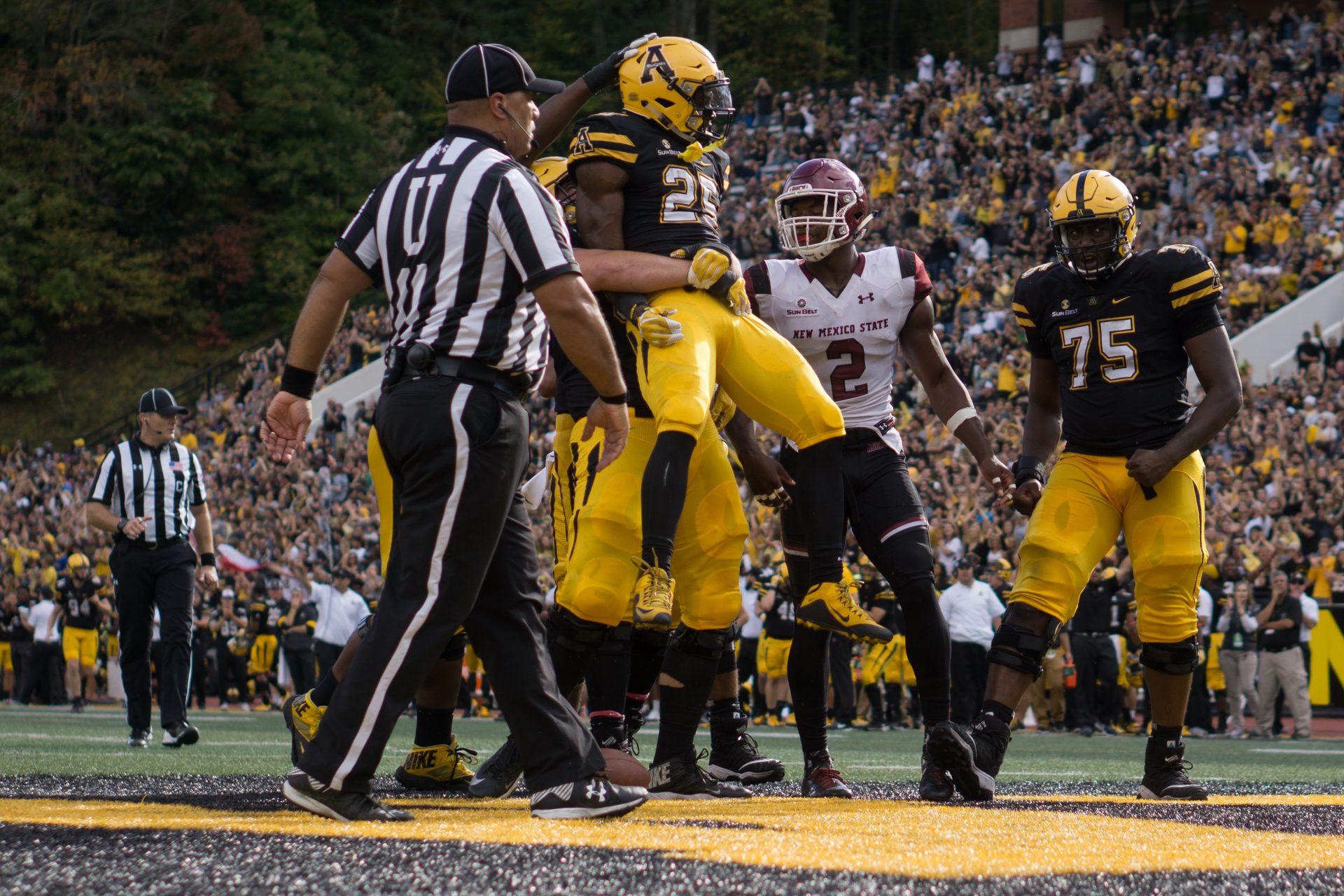 Duck, Hayes have an interception fest against the Aggies in Mountaineers 45-31 victory
