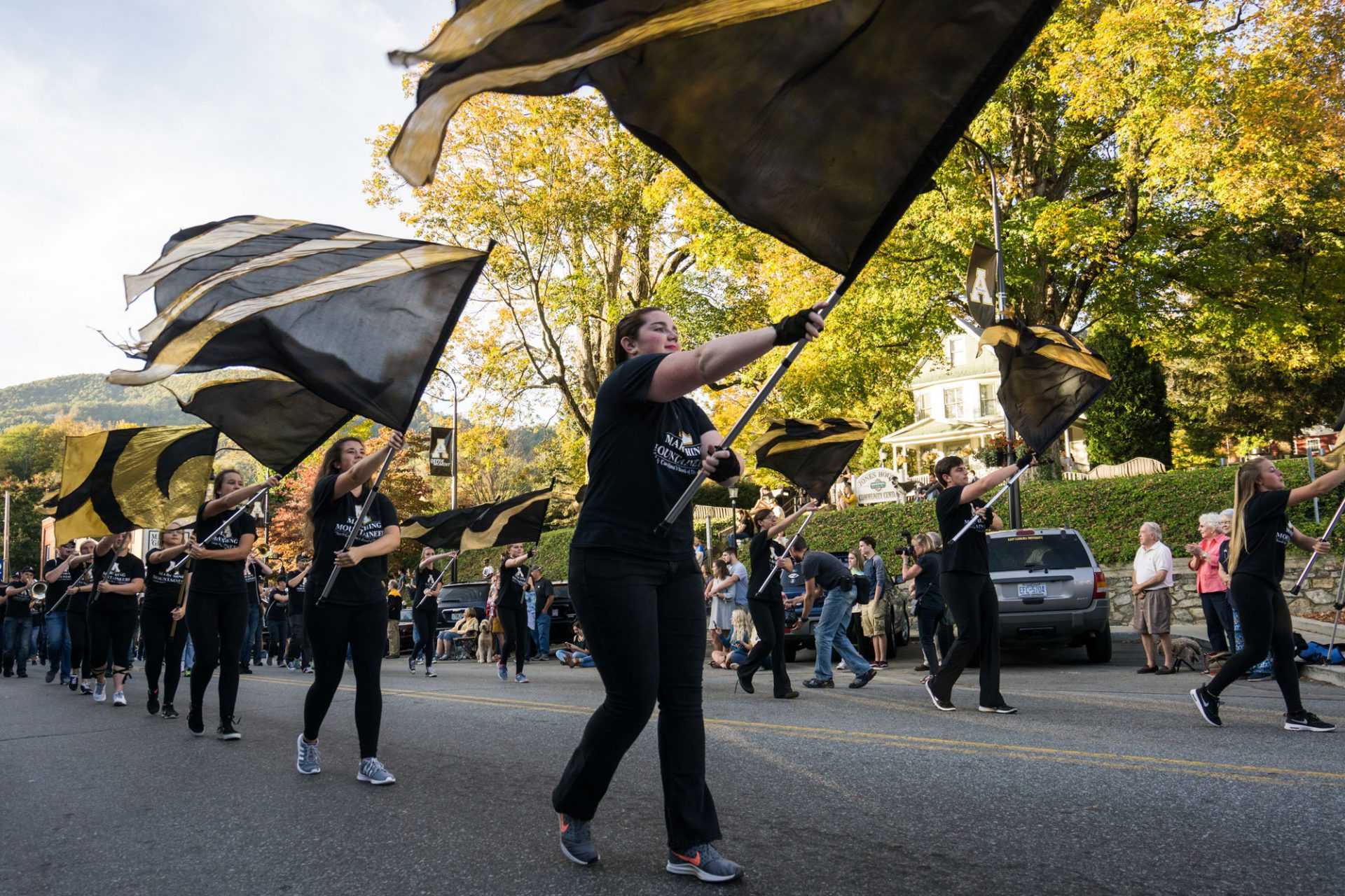 Members of App State’s Color Guard fly their flags with pride at the Homecoming parade.