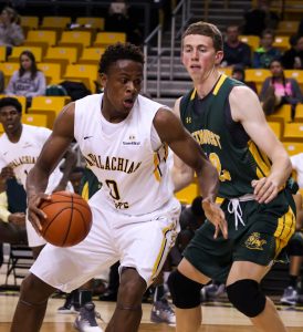 Freshman forward Isaac Johnson guards the ball against Methodist. Photo by: Braxton Critcher, Photographer