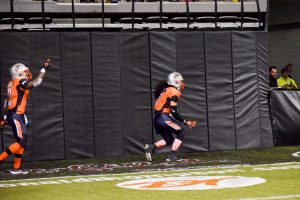 Malachi Jones scoring a touchdown during the first ever Grizzlies game. The Grizzlies are an indoor football team. 