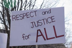 A sign from the march on Saturday. Signs voiced grievances over reproductive rights, police brutality, healthcare, representation in the state and federal government and other issues.