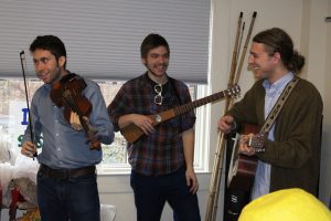 Bluegrass band “Major Sevens” preforming at the Watauga County Public Library before the start of the parade. From left to right: Drayton Aldridge, Brooks Forsyth and Lucas Triba