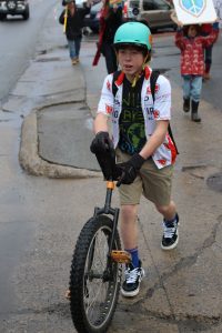 Landrum Redman bringing up the rear of the parade on his uni-cycle. The Peacefull People’s Parade was on January 23rd and it started at the public library.