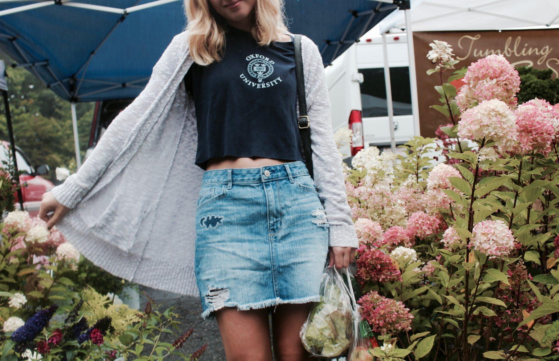 Hayley Hughes modeling a denim skirt titled Upcycled Moon Cloud Skirt. This skirt was designed by the Raining Sunshine Co.