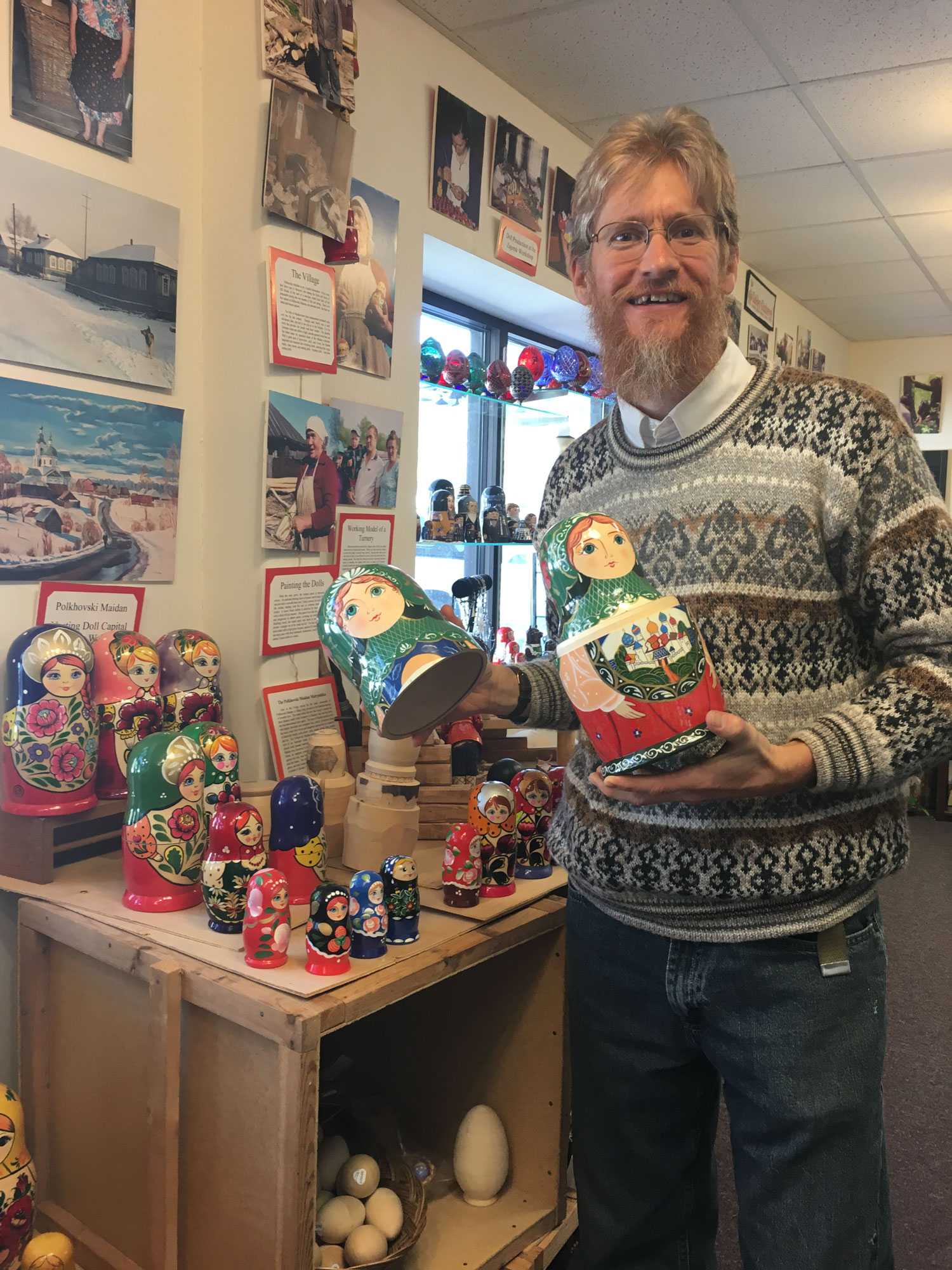 Golden Cockerel owner Walton Conway poses with some of the stores nesting dolls.