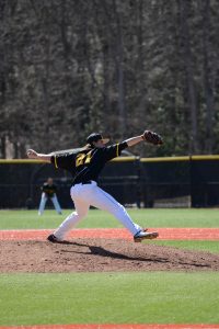 Sophomore pitcher Colin Schmid winds up for the pitch during the home game against the Quinnipiac Bobcats.