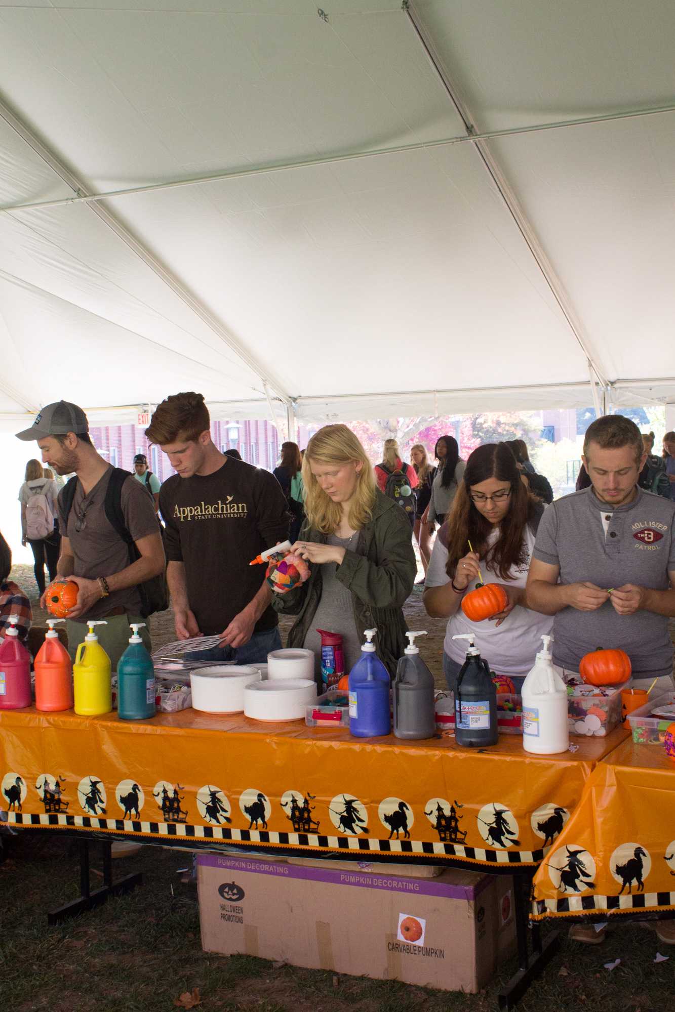 Students decorate pumpkins for Mountaineer Spirit Day on Sanford Mall.