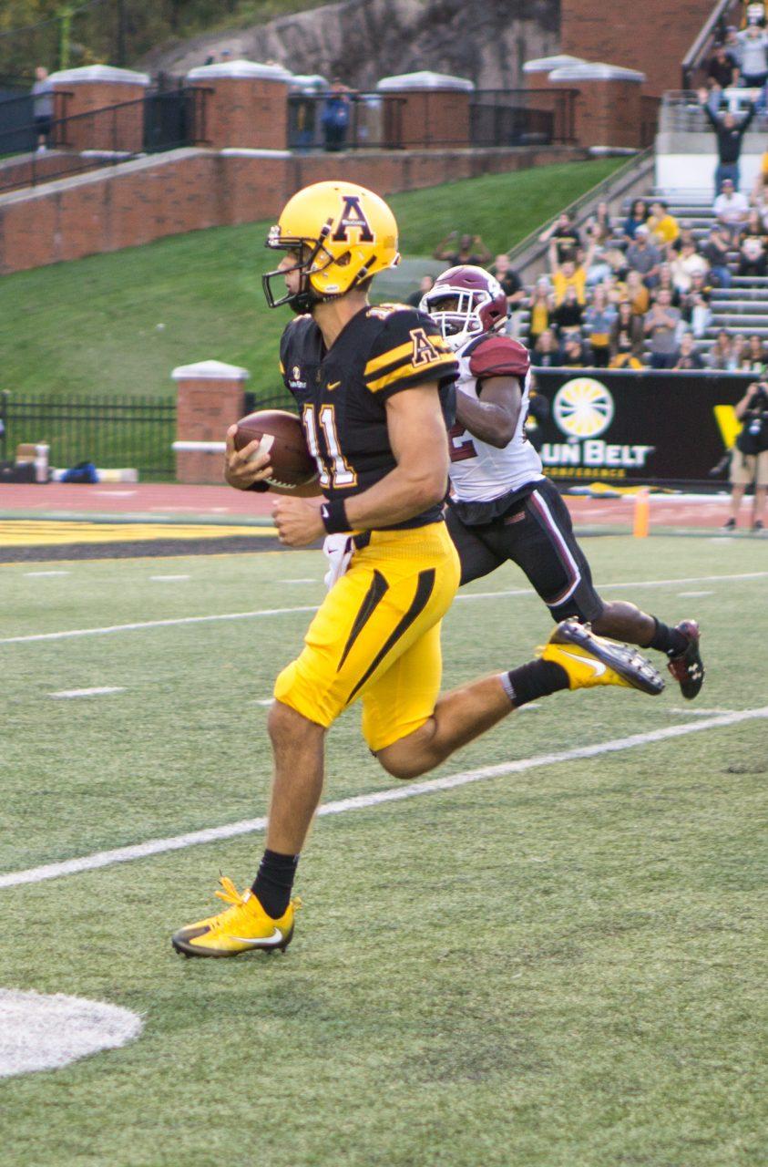 Senior quarterback Taylor Lamb running the ball to the end zone to score a touchdown during the game against New Mexico State on Saturday, October 7th. Taylor is graduating and played his last home game at App State last Saturday. 