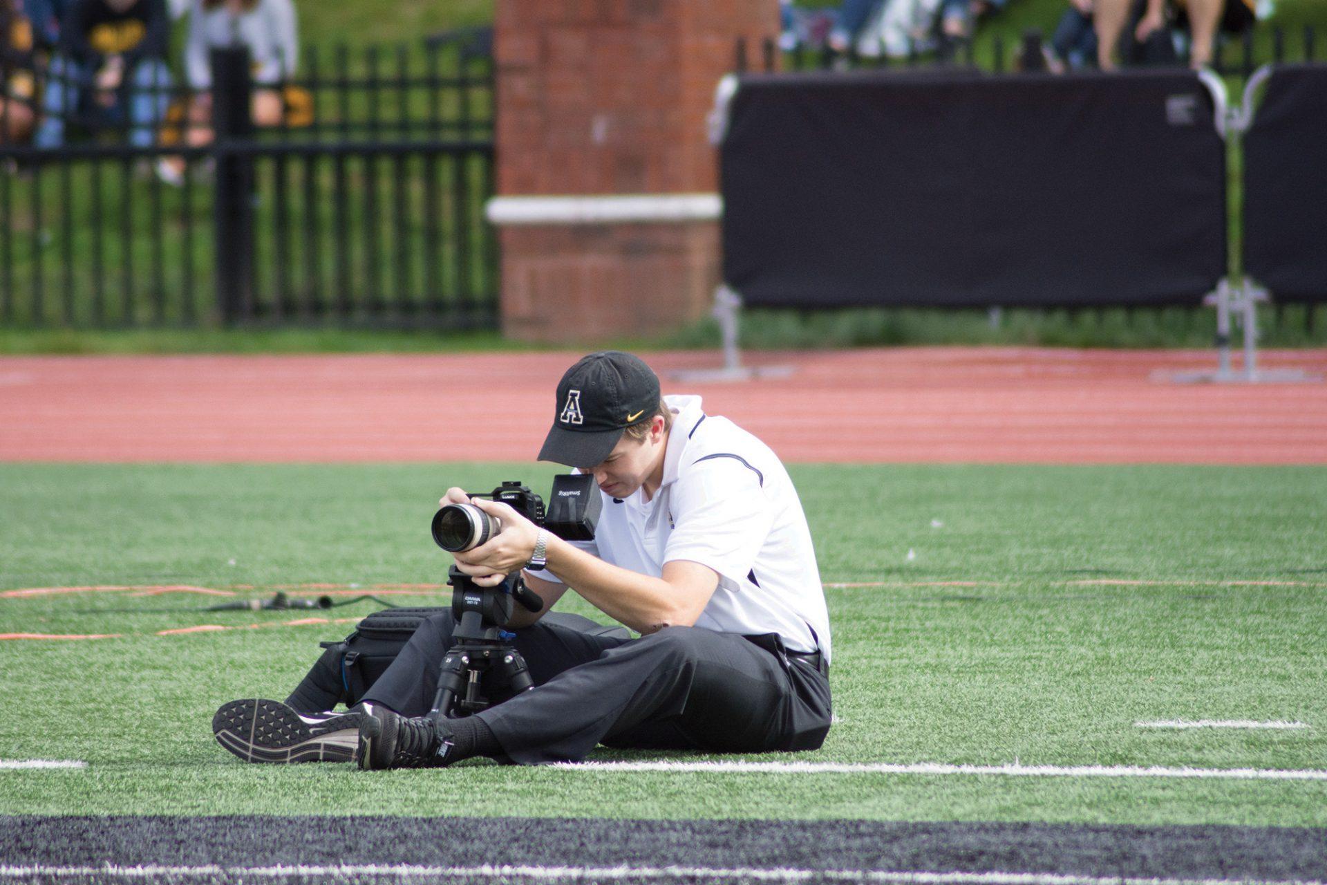Carson Fletcher sitting in game position videoing the Appalachian State football team at Kidd Brewer Stadium on October 7, 2017.