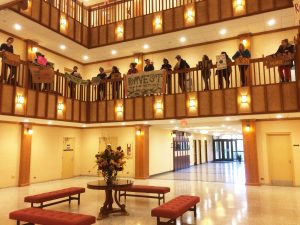 Students protesting in BB Dougherty for fossil fuel divestment. A letter was delivered to administration with their demands.