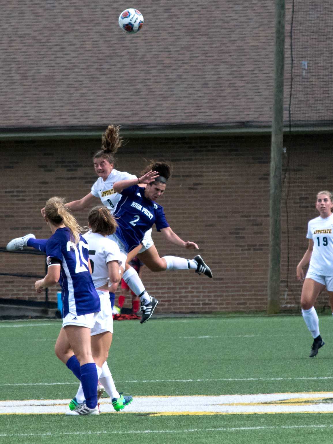 Senior Lindsey Tully jumps to try and get contact with the ball and gain possestion against High Point.