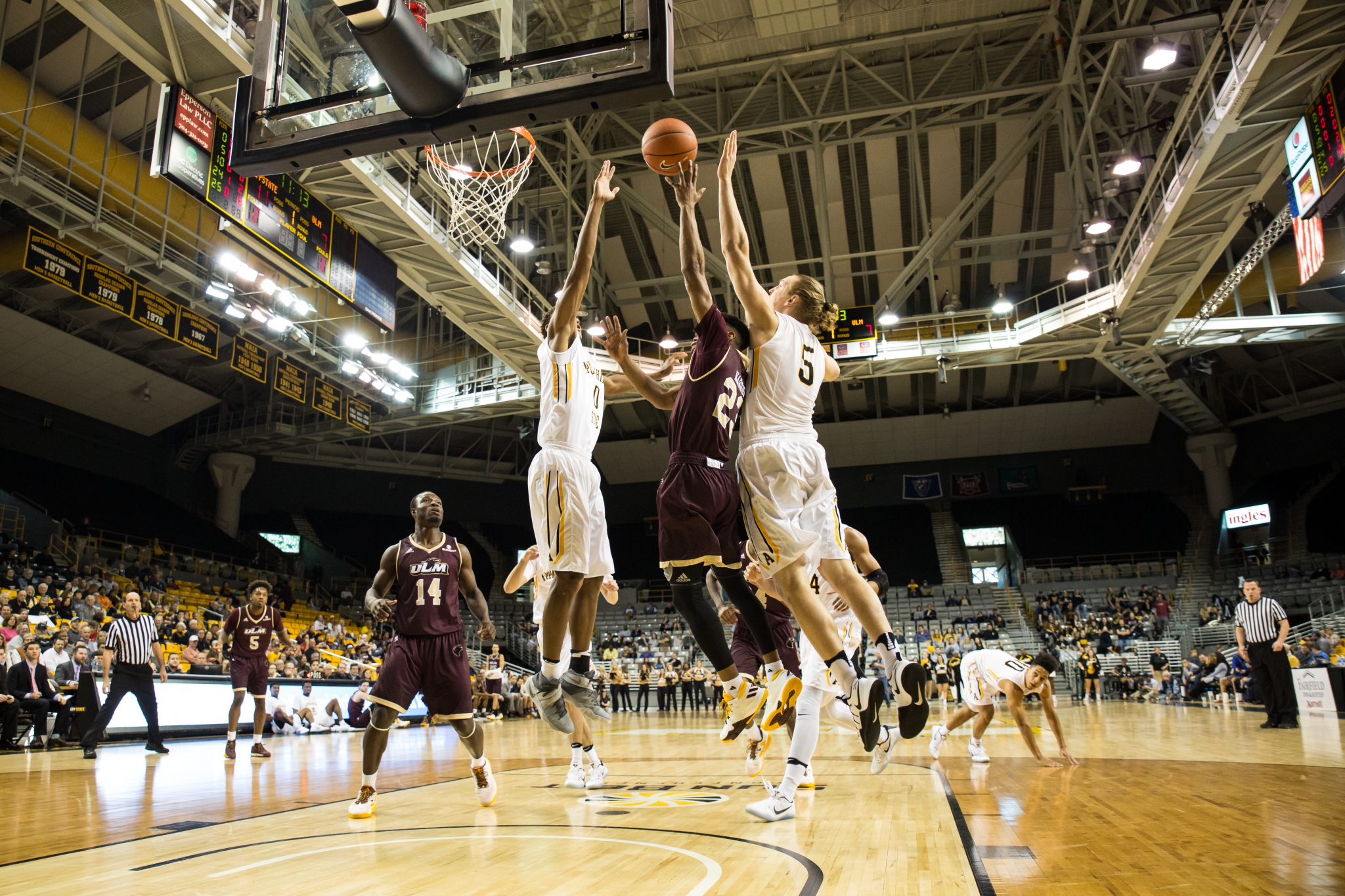 App States Griffin Kinney and Isaac Johnson combine to block a Warhawks layup attempt.